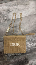 Pochette Dior in paglia con catena