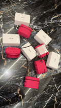 Bauletto Dior fucsia con catena nera